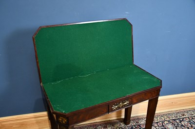 Lot 39 - A 19th century mahogany fold-over tea table...