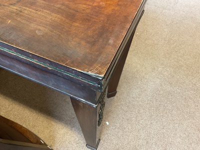 Lot 39 - A 19th century mahogany fold-over tea table...