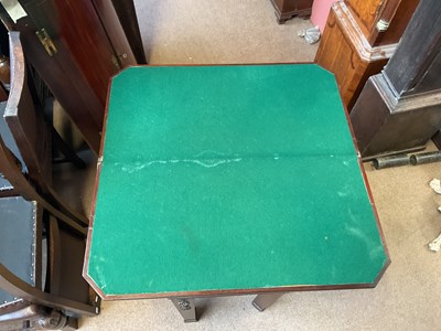 Lot 39 - A 19th century mahogany fold-over tea table...