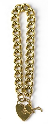 Lot 807 - A 9ct yellow gold curb link bracelet with a...