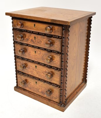 Lot 20 - An Oregon pine collectors' cabinet of five...