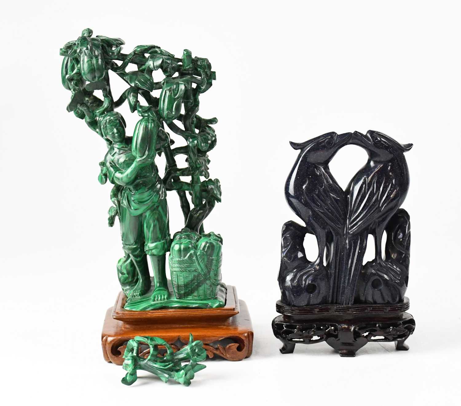 Lot 394 - A Chinese carved malachite figure stood...