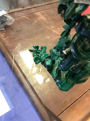 Lot 394 - A Chinese carved malachite figure stood...