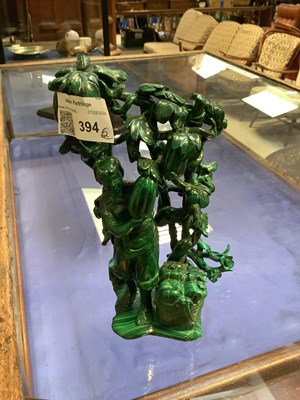 Lot 394 - A Chinese carved malachite figure stood...