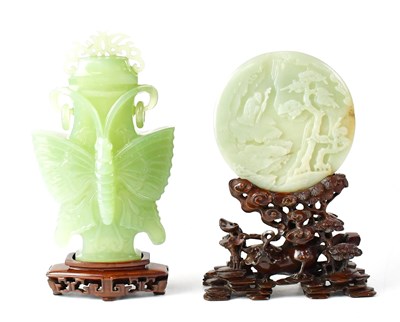 Lot 401 - A Chinese carved jade Bi disc, the front with...