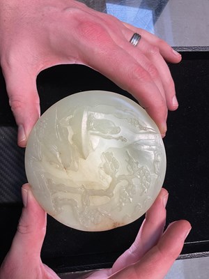 Lot 401 - A Chinese carved jade Bi disc, the front with...