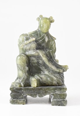 Lot 380 - A Chinese carved soapstone figure of a female...