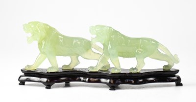 Lot 381 - A Chinese carving depicting two lionesses,...