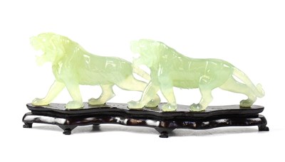 Lot 381 - A Chinese carving depicting two lionesses,...