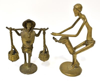 Lot 436 - An African polished brass abstract figure of a...