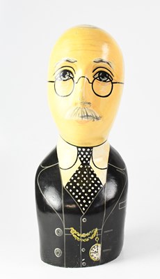 Lot 167 - A painted wooden bust of a bespectacled,...