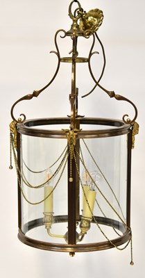 Lot 107 - A brass conical hall lantern with satyr head...