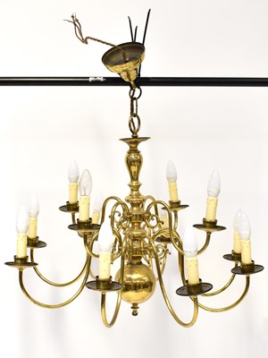 Lot 105 - A twelve-branch brass-effect Dutch style...