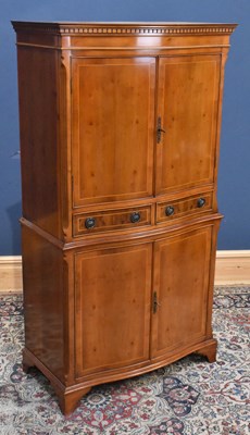 Lot 189 - A reproduction yew wood serpentine front...