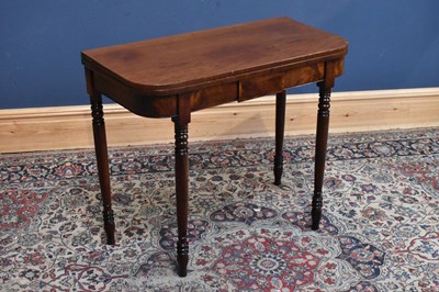 Lot 93 - A Georgian mahogany fold-over tea table on...