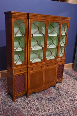 Lot 188 - A reproduction yew wood bookcase with moulded...