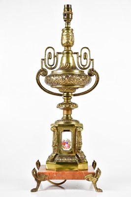 Lot 2222 - A gilt metal urn table lamp with enamel panels...