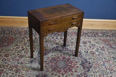 Lot 1230 - A 1920s oak two drawer canteen of silver...