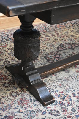 Lot 4 - A reproduction dark oak refectory dining table...