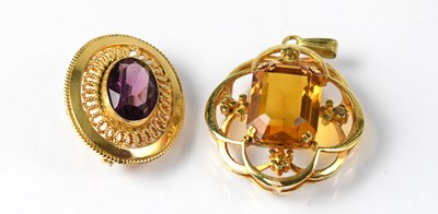 Lot 824 - A yellow metal brooch set with an oval...