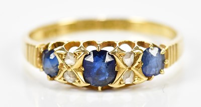 Lot 150 - An 18ct yellow gold sapphire and diamond ring...