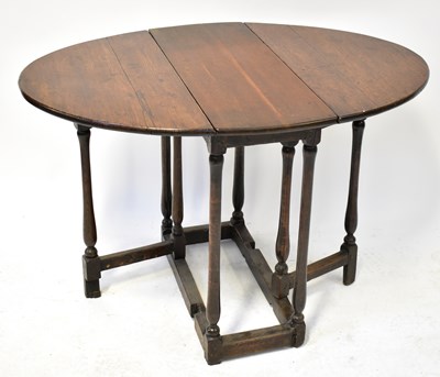 Lot 65 - A 19th century oak dropleaf gateleg table, 72...