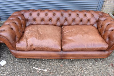 Lot 9 - A pair of modern brown leather button...