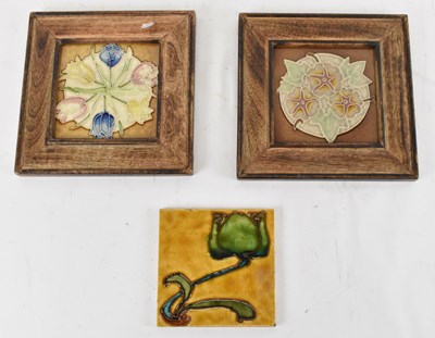 Lot 523 - A group of three Art Nouveau tiles, two in oak...