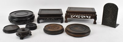 Lot 633 - A group of eight Chinese carved hardwood...