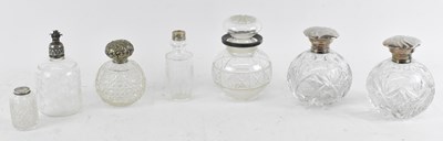 Lot 748 - A group of seven white metal topped cut glass...