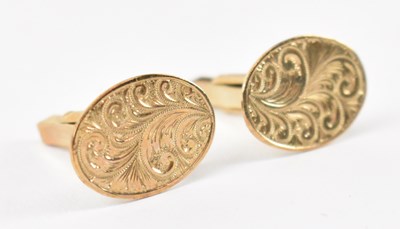 Lot 838 - A pair of 9ct yellow gold cufflinks, combined...