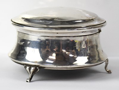 Lot 609 - A George V silver jewellery box of circular...