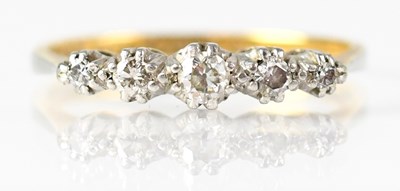 Lot 744 - A 15ct yellow gold ring set with five...