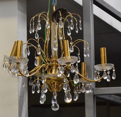 Lot 143 - A modern brass effect and cut glass chandelier,...