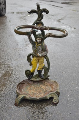 Lot 397 - A cast iron painted figural stick stand,...