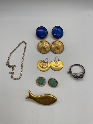 Lot 529 - SPHINX; a pair of gold effect clip-on earrings,...