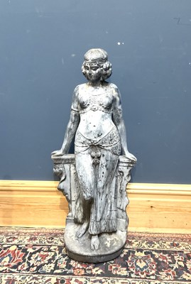 Lot 384 - A reconstituted stone garden figure of a...