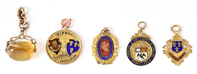 Lot 493 - Four 9ct gold football medals, comprising...