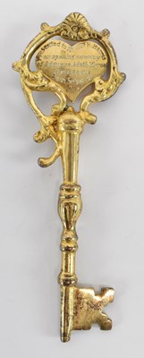 Lot 348 - A gilt metal presentation key with inscription...