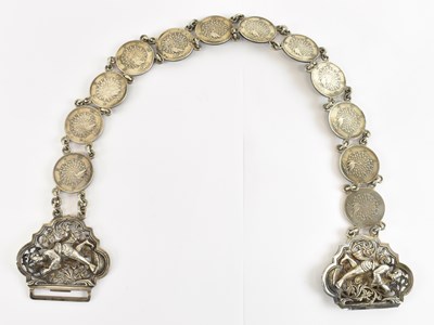 Lot 751 - An Indian white metal sari belt, the clasp...