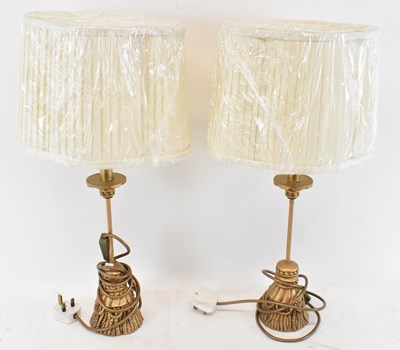 Lot 147 - A pair of modern gilt effect table lamps with...