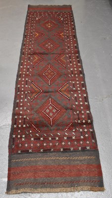 Lot 106 - A handmade Meshwani runner, 247 x 62cm.