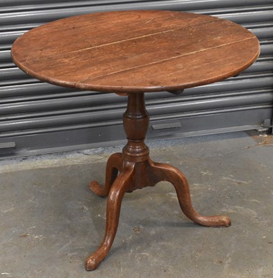 Lot 85 - A 19th century oak circular tilt-top...