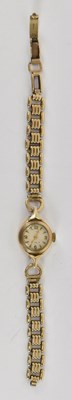 Lot 885 - A lady's 9ct yellow gold wristwatch, length...