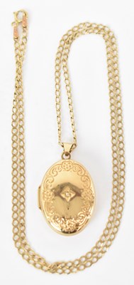 Lot 823 - A 9ct yellow gold necklace suspending a 9ct...