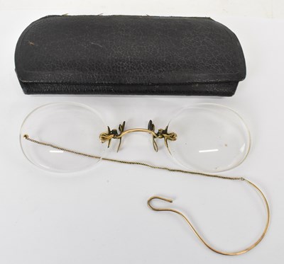 Lot 847 - A pair of yellow metal mounted spectacles...