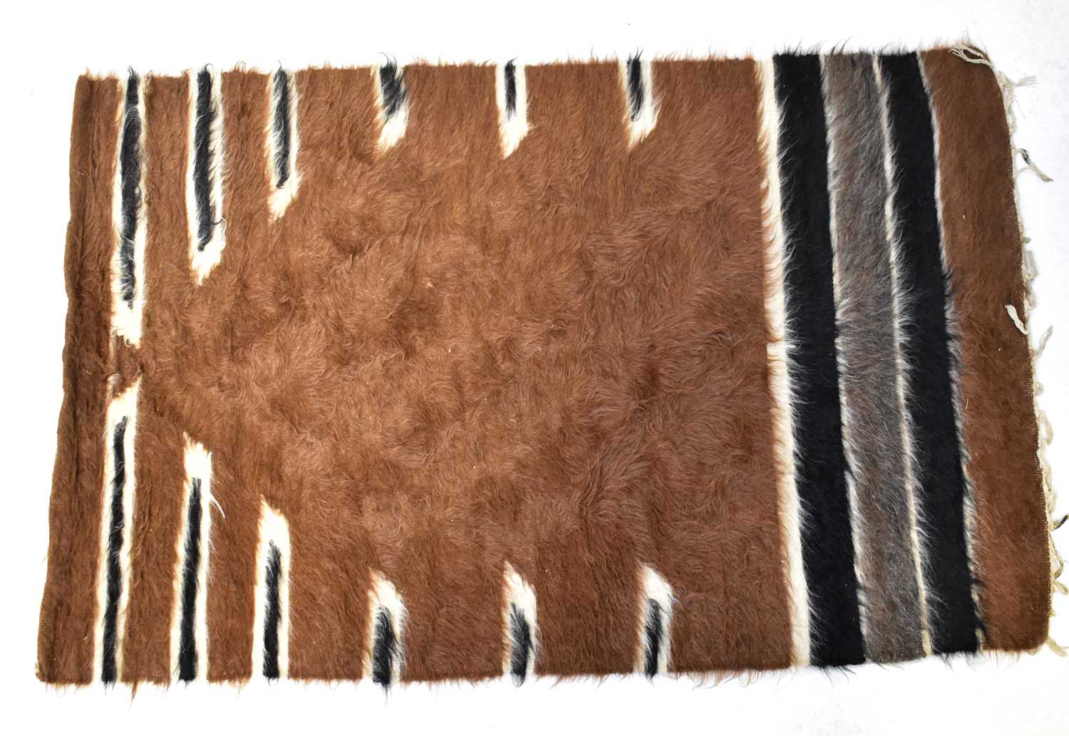 Lot 135 - A Nigerian goat hair hand-woven rug, cream,
