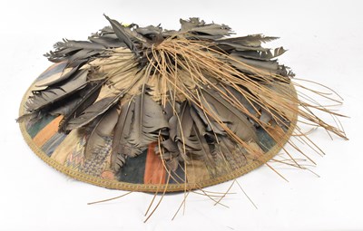 Lot 639 - A Southeast Asian straw wide brimmed hat with...