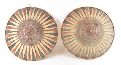 Lot 607 - A pair of Southeast Asian straw wide brimmed...