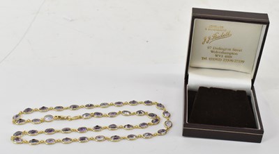 Lot 802 - An 18ct yellow gold amethyst necklet...